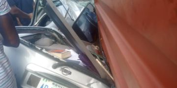 Lagos state- Woman dies as container crushes car
