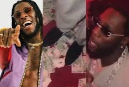 “EFCC go soon reach your side”—Fans Reacts After Burna Boy Steps on Naira Notes While Dancing at Nightclub