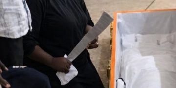 Vengeance: Mother Places Cutlass in Son’s Coffin During Funeral in Jos