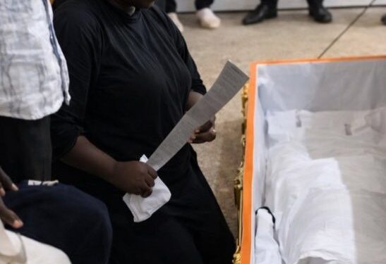 Vengeance: Mother Places Cutlass in Son’s Coffin During Funeral in Jos